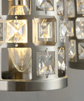 Close-up of crystal shades on Four Light Brushed Nickel Vanity Light Over Mirror With Cylinder Crystal Shades
