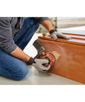 Person using Cordless Orbital Sander With 12,000 OPM For Fast Material Removal on wooden furniture. Lightweight and easy to use.