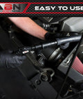 Slick Radiator Flush Kit Gun With Garden Hose Quick Connect being used on a car engine for efficient flushing.