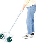 Person using Rolling Lawn Aerator With 39 Iron Spikes And 58 Inch Handle, Heavy Duty Manual Aerator Tool for lawn care