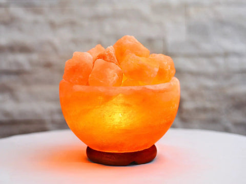 Himalayan Salt Chip Bowl Lamp With Dimmer Switch Hand-Carved Stone Salt Lamp On Premium Wood Base emitting warm glow on table