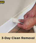 Person removing Contractor Grade Masking Tape That Sticks Like A Pro 0.94 Inch By 60.1 Yards Per Roll 9 Rolls High Adhesion Painter Tape