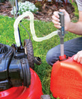 Ontel Turbo Pump automatic liquid transfer pump; gray pump with clear hose transferring gasoline from red can to lawn mower tank.