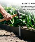 Person using hammer with Landscape Edging Stakes Set, 13 Piece, 8 Inch Corrugated Metal Garden Stakes, in garden