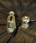 Close-up of Finger Guard Knife Making Kit With Bolster And Pommel For Custom Blades Hand Cast Bronze Set, on wood.
