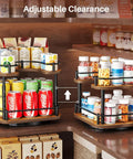 Two Tier In Cabinet Spice Rack Organizer With Rotating Lazy Susan storing drinks and snacks, adjustable clearance shown