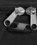 Close-up of Ultra Durable Mini Carabiner Clips 4 Pack For Zippers attached to black bag zipper for security