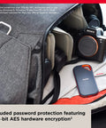 1TB Extreme Pro Portable SSD with camera gear in backpack, shows USB-C compatibility, rugged design, IP65 rating visible