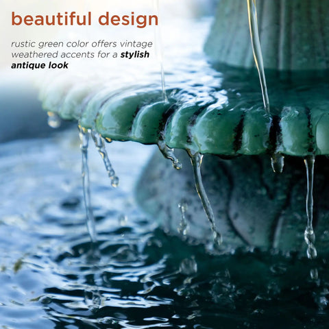 Close-up of water flowing over a green pedestal in the 35 Inch Outdoor Pedestal Water Fountain With 3 Tier Cascade, Durable Resin Birdbath For Garden Patio Deck And Backyard Green Finish, Calming Water Feature For Yard Ambiance And Garden Decor.