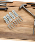 Extra Heavy Duty Wall Mount Fence Gate Hinge Set For Barn And Wood Doors Built Like A Tank Super Strong Rural Storage Gate Hardware Four Piece Kit with bolts on wood surface.