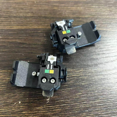 SP-03 Original Fiber Holder Chucking Jig for Fusion Splicer Clamps, view of two units on wooden surface