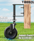 5 Inch Spring Loaded Gate Caster With Side Brake For Outdoor Wooden Gates And Fences, Heavy Duty Wheel With 360 Degree Swivel, Anti Sag Gate Kit, 220 Lb Capacity, Black, 1 Pack attached to wooden gate on grass
