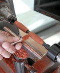 BMWOOD PM-002 MT2 pen mandrel kit in use on a wood lathe with orange bushings and a turned wood pen blank.