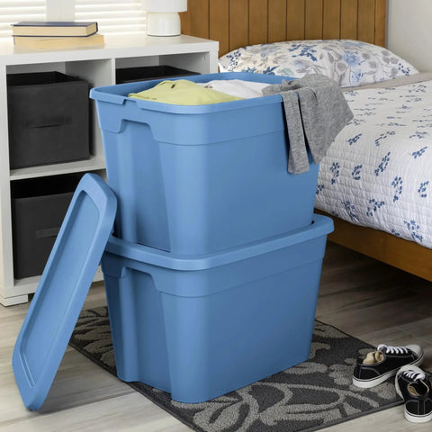 Straight Up Beast Mode 18 Gallon Plastic Storage Bin With Secure Snap On Lid Stackable Heavy Duty Moving Container For Workshop Home Office Or Backyard Shed Blue with clothes in a bedroom.