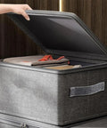 Slick Fabric Storage Bin With Combination Lock Waterproof Foldable Wardrobe Organizer Keeps Your Essentials Safe Collapsible Drawer Tote open with clothes inside.