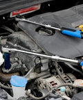 Mechanic using Extendable Ratchet Socket Set With Quick Release And Reversible Gear Three Drive Sizes One Quarter Inch, Three Eighths Inch, And One Half Inch Heavy Duty Wrench Kit for engine repair.