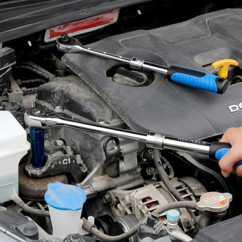 Mechanic using Extendable Ratchet Socket Set With Quick Release And Reversible Gear Three Drive Sizes One Quarter Inch, Three Eighths Inch, And One Half Inch Heavy Duty Wrench Kit for engine repair.