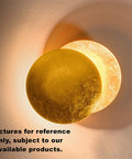 Two Pack Rotatable LED Wall Sconce Moon Eclipse Mood Light Gold Brass Finish creating ambient glow on wall