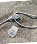 Cast iron sliding gate pulley on sandy surface for gates