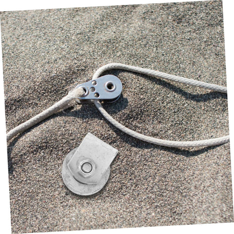 Cast iron sliding gate pulley on sandy surface for gates