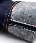 Close-up of 16oz Heavyweight Selvedge Denim Fabric 100 Percent Cotton Raw Indigo side showing selvedge edge detail in narrow width.