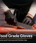 FifthPulse black nitrile gloves, 6 mil, Large, worn while slicing meat on a red cutting board