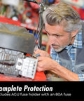 Mechanic installing 8 Gauge Power Wire 1ft With 100 AGU Fuse Holder And Ninety Nine Point Nine Percent Oxygen Free Copper Soft Touch Jacket