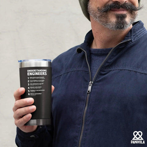 Understanding Engineers Funny Engineer Gifts 20 Oz Vacuum Insulated Tumbler Black held by a bearded man in a blue jacket.