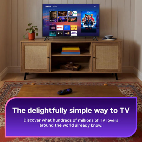 55 Inch QLED Smart TV With Sharp 4K Resolution And Rich HDR10 Colors Plus Slick Built In Apps For Smooth Streaming and Crisp Picture Tuning setup on wooden media console.
