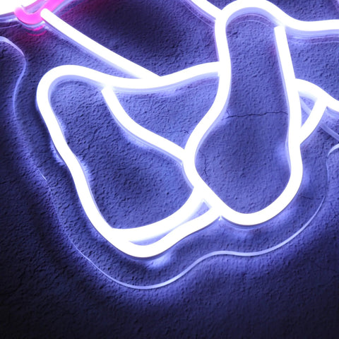 Close-up of Dimmable Pink Neon Sign for Wall Decor Girls Bedroom LED Light USB Powered Neon Bar Signs glowing in dark room