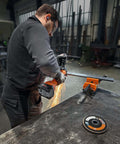 Built Tough 18 Volt Cordless Angle Grinder, Brushless Motor Workhorse For No Sweat Cutting And Deburring, Soft Start Safety, 125 Mm Disc, Tool Only Without Battery Or Charger Included in use, sparks flying.