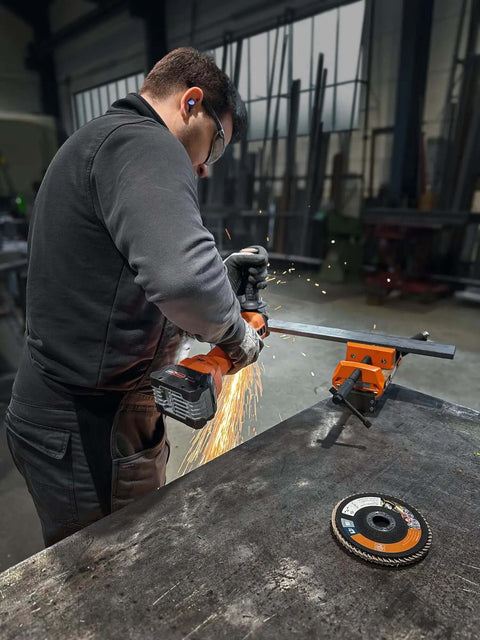 Built Tough 18 Volt Cordless Angle Grinder, Brushless Motor Workhorse For No Sweat Cutting And Deburring, Soft Start Safety, 125 Mm Disc, Tool Only Without Battery Or Charger Included in use, sparks flying.