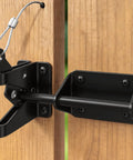 Tough As Nails Heavy Duty Gate Latch With Cable Pull For Wooden Fence attached to wooden fence, featuring thick gauge steel and rust-free finish.