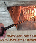 Person using Beefy 40 Inch Heavy Duty Fire Poker With Twisted Rope Grip Solid 12mm Steel Wrought Iron Fireplace Tool on firewood in an indoor fireplace.