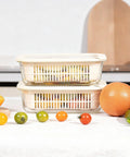 Square Glass Food Storage Containers With Glass Lids For Grab And Go Meals Microwave Safe Borosilicate Glass Leakproof Meal Prep Set BPA Free Removable Colander Silicone Lid 2 Pack on a table with fruits