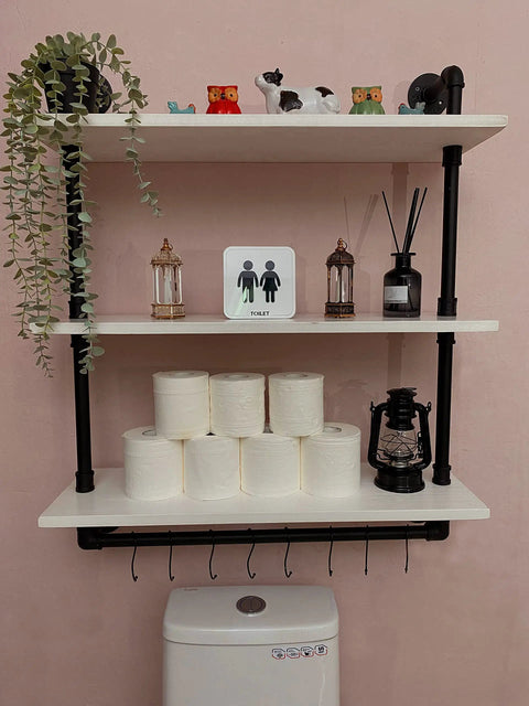Industrial Pipe Shelving With Towel Rack 3 Tier 30 Inch Rustic White Floating Shelves above toilet with decor and toiletry items.