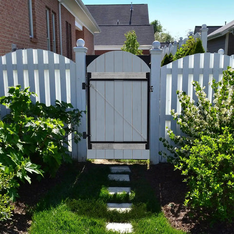 Beefed Up Full Frame Gate Fence Kit For 60 To 96 Inch Openings And Up To 5 Feet High installed on a white picket fence