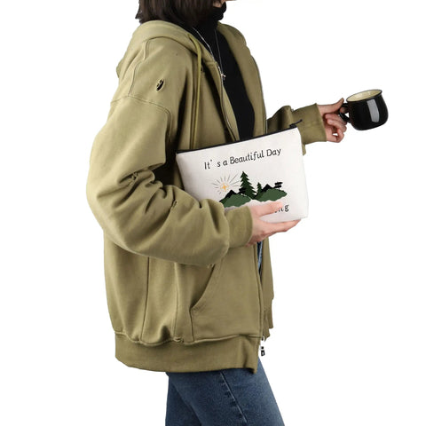 Person holding Geocaching Makeup Bag For Outdoor Lovers It Is A Beautiful Day For Geocaching Gift Beige Durable Canvas Zip Bag