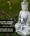 Totally Lit Glowing Lotus Buddha Statue With Solar Powered Flickering LED Garden Light in grassy outdoor setting, morning energy absorption