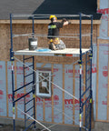 Heavy Duty Scaffold Guardrail System 5 Feet Wide 7 Feet Deep Built Like A Tank Jobsite Fall Protection Kit with worker on scaffold.