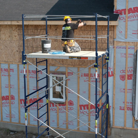 Heavy Duty Scaffold Guardrail System 5 Feet Wide 7 Feet Deep Built Like A Tank Jobsite Fall Protection Kit with worker on scaffold.