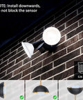 Boss Outdoor Motion Sensor Flood Light 5000K Daylight LED installed on brick wall with E26 base, focus on sensor placement.