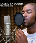 Singer using Ma-87 Studio Condenser Microphone With 26mm Gold Diaphragm Capsule For Singing, Vocal Recording, And Podcasting.