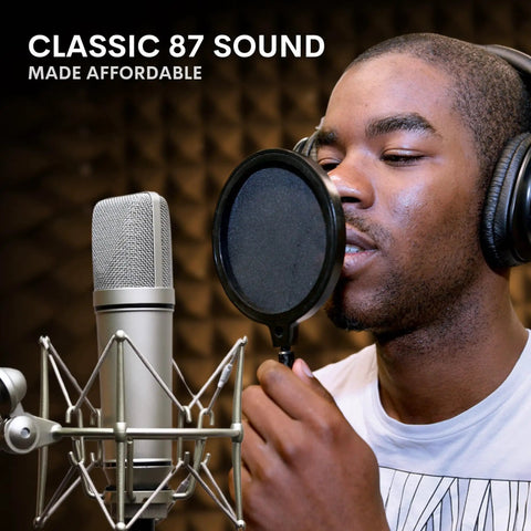Singer using Ma-87 Studio Condenser Microphone With 26mm Gold Diaphragm Capsule For Singing, Vocal Recording, And Podcasting.