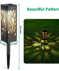 Upgraded Solar Pathway Lights Bigger and Brighter Outdoor LED Landscape Lighting with decorative patterns on grass.