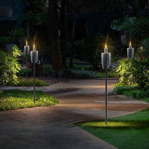 Stainless Steel Outdoor Torches Set Of 2 5 Ft Citronella Oil Lamps With Fiberglass Wick and Snuffer Cap lighting a garden path
