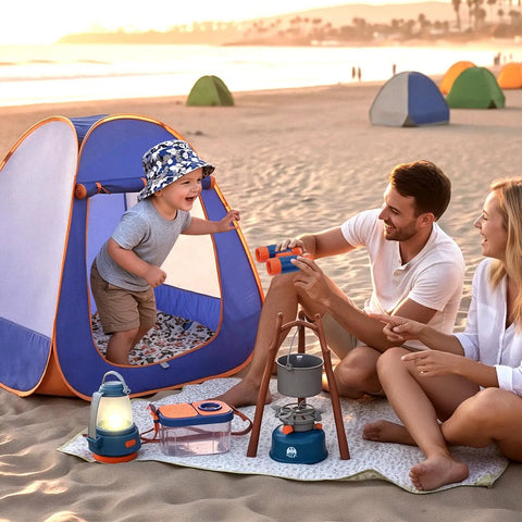 Family playing with Kids Camping Set With Pop Up Tent And Outdoor Gear For Pretend Play Adventures on the beach at sunset