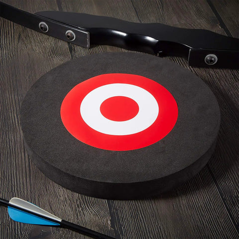 Round EVA Foam Arrow Target For Archery Training, Portable Backyard And Indoor Outdoor Practice Target, with bow and arrow nearby.