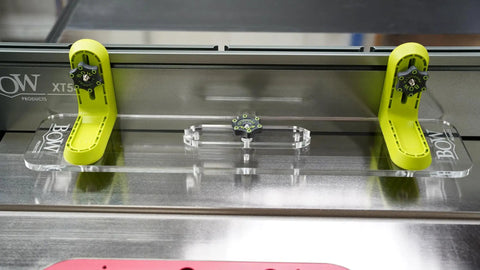 Dead Solid L Fence Extender Kit Xt4 for table saws, featuring green brackets and clear acrylic panel for precise cuts.