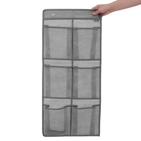 Slick Door Shoe Organizer With Six Deep Mesh Pockets And Heavy Duty Hanging Hooks, grey fabric, shown being held by hand.